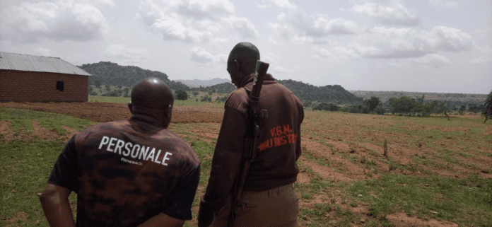 Citizen guards patrol a village in Plateau state after a land-grabbing massacre by terrorists in May 2023. Credit Masara Kim.