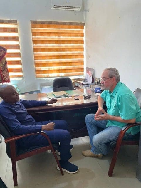 Garki hospital administrator hears plea from philanthropist Mike Arnold, right, on Oct. 24. Credit: Mike Arnold. 