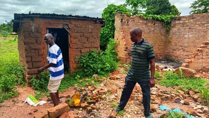Residents of Yelewata taking TruthNigeria correspondents round the ruins of Yelewata. Photo by Mike Odeh James.