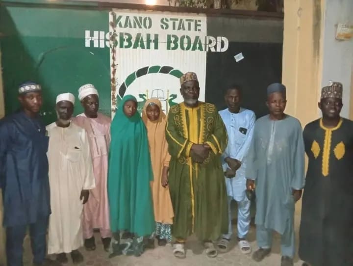 Jinkai in Yellow hijab with Muslim Clerics