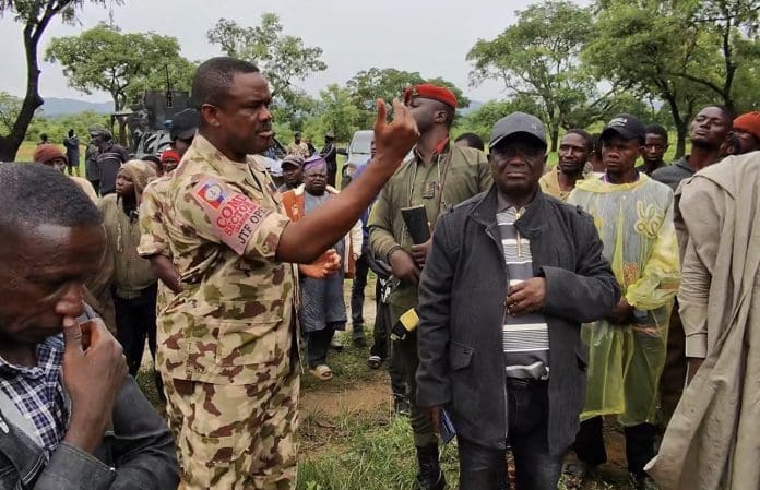 Col. Victor Asuquo on June 1 addresses youths in Gwom Ajang village in Foron district of Barkin Ladi after terrorists kill 11 in evening raids near Plateau-Bauchi border. Credit Masara Kim.