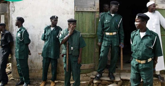 Picture Shows Kano State Hisbah (Islamic moral police) officers in green uniform banning entry into a suspected liquor store in Sabon Gari, Christian dominated area of Kano town in 2025 (Credit: Kano State Hisbah Facebook)