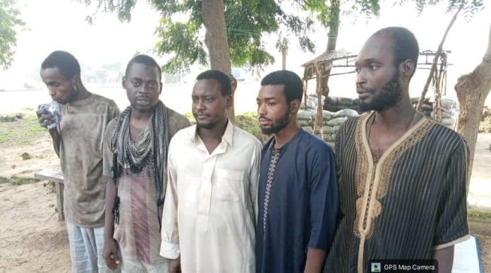 Nura Abdullahi (in white) with four others who escaped from bandits. Photo credit: X/@ZagaZolaMakama.