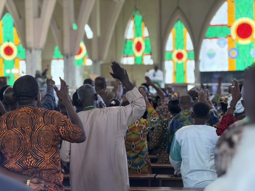 A crowd of congregants lift their hands in prayer at “Operation Psalm 91” crusade in Abuja Oct. 2-3. Photo by Masara Kim/TruthNigeria.